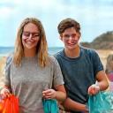 Volunteers participating in a beach clean-up operation